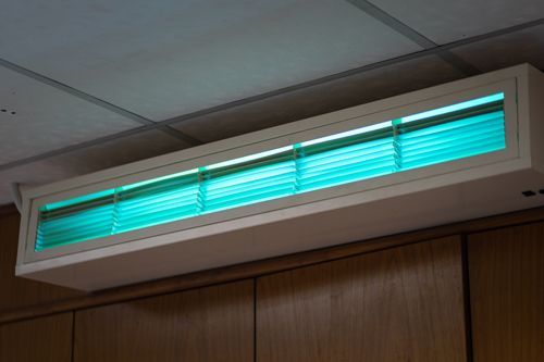 A Green Light Is Hanging From The Ceiling Of A Room - Maricopa, AZ - Eco Mechanical LLC A Green Light Is Hanging From The Ceiling Of A Room - Maricopa, AZ - Eco Mechanical LLC
