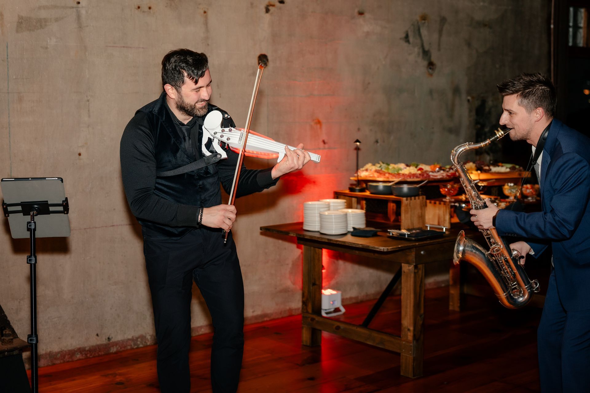 Violinist performing at an event.