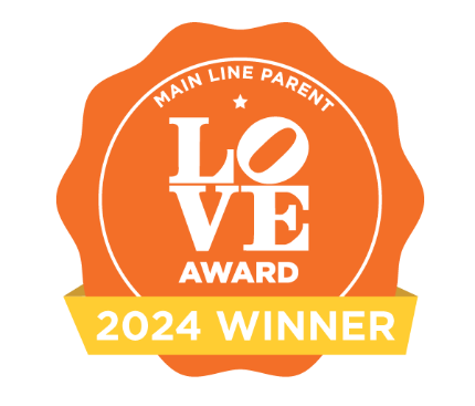 A orange ribbon for the 2024 Main Line Parent Love Award Winner Empower Event Group.