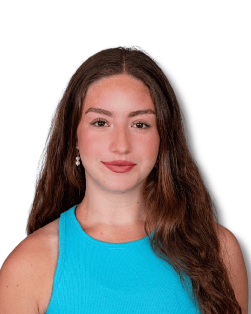 Talia posing for a picture wearing a blue shirt.