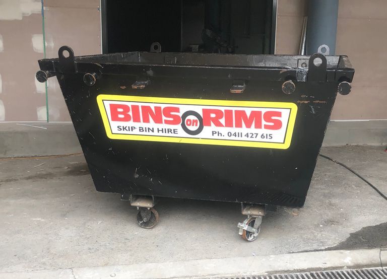 Bins rims skip bin hire is advertised on this dumpster — Bins on Rims in Kempsey, NSW