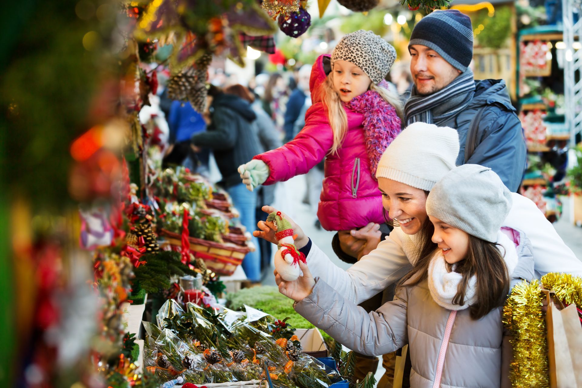 A family is shopping at a christmas market.