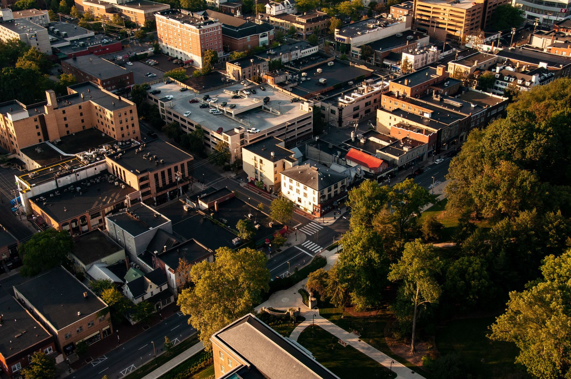 An aerial view of a city with lots of buildings and trees