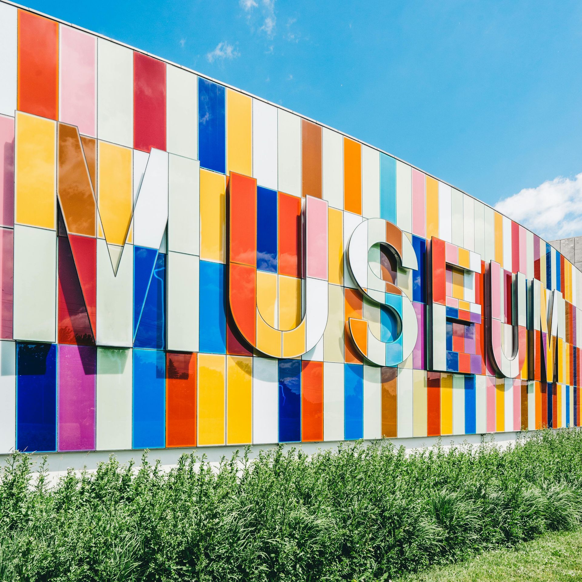 A colorful wall with the word museum on it