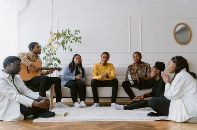A group of Black people in a living room. 