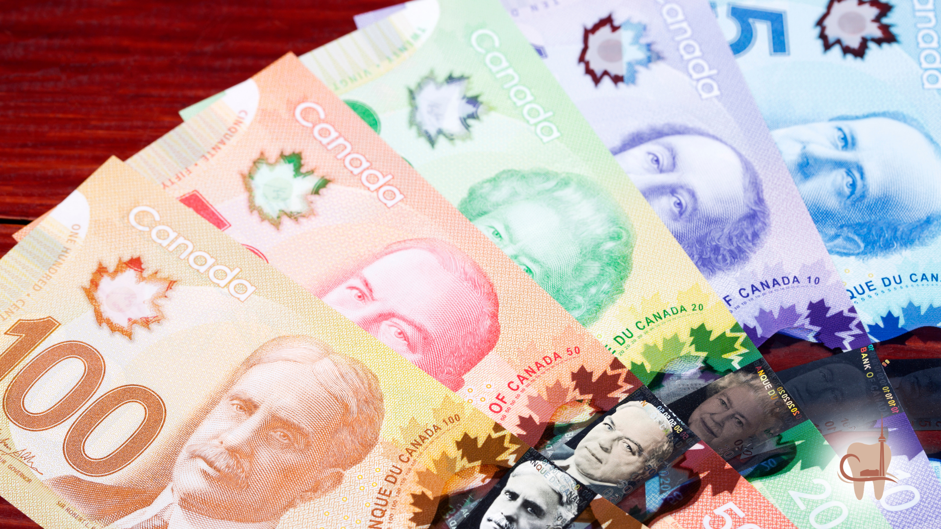 Canadian currency scattered. Includes $50 and $100 bills.