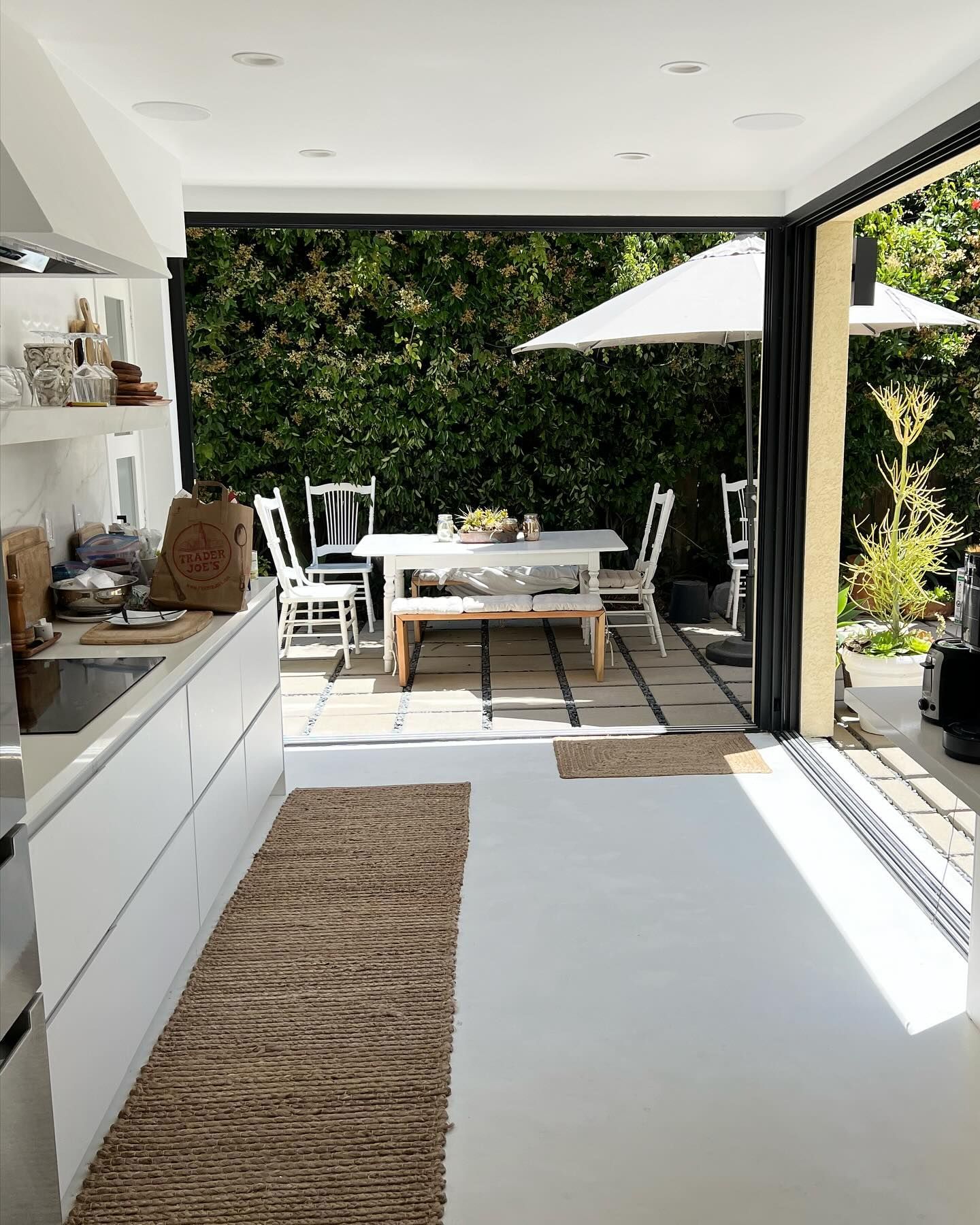 A kitchen with a table and chairs in it