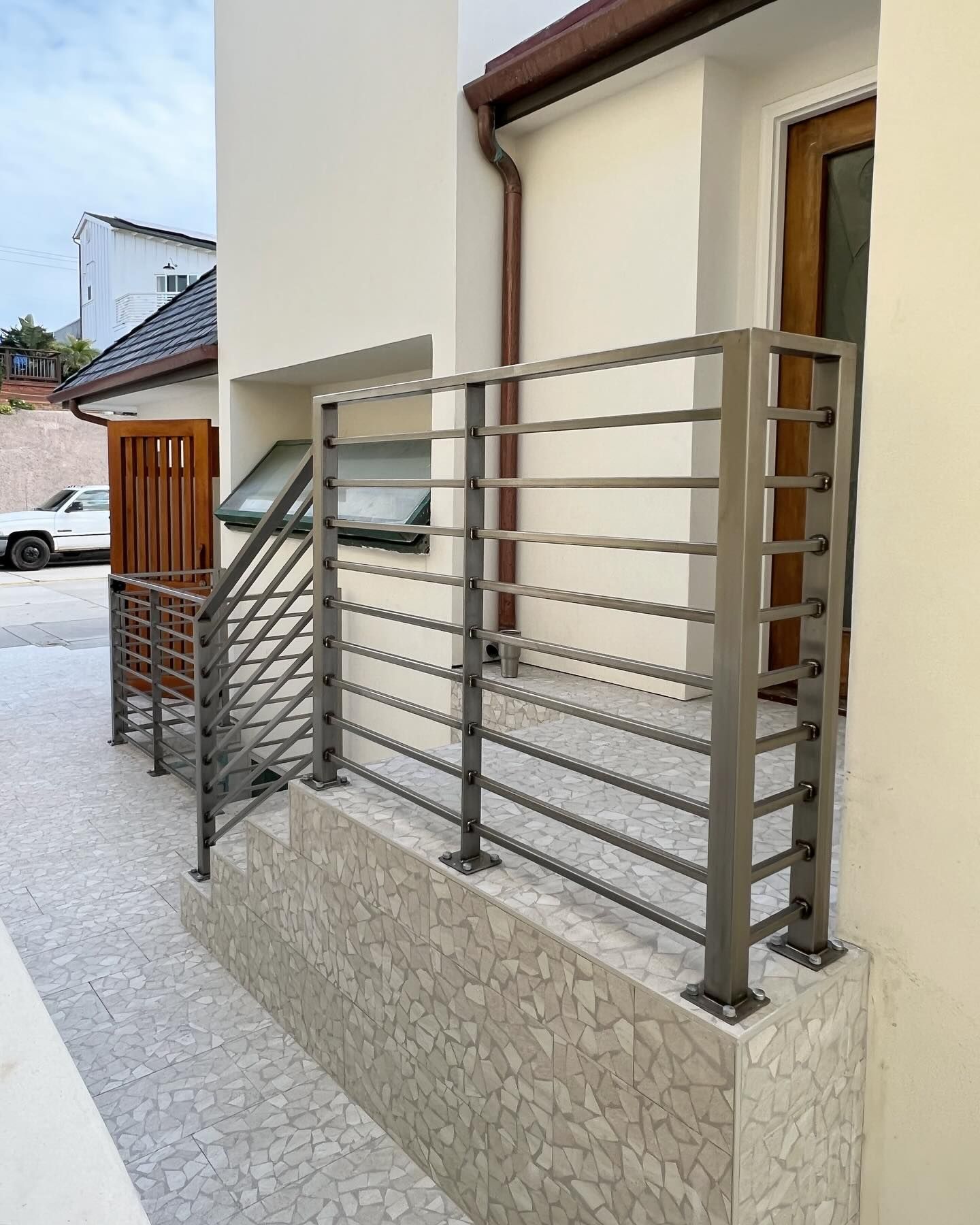 A metal railing on the side of a building