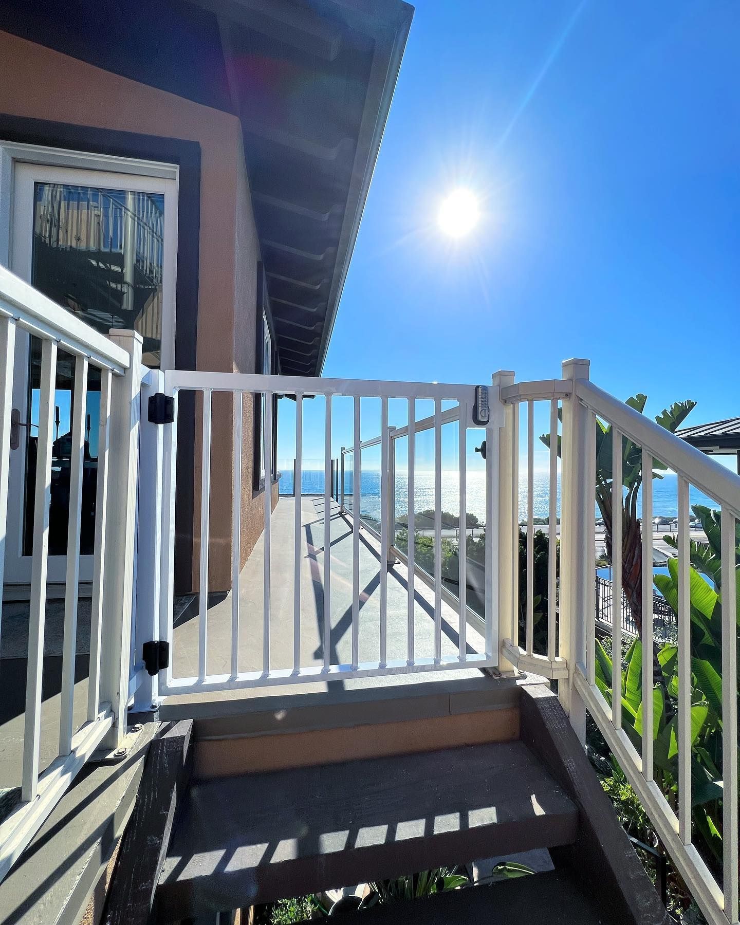 Stairs leading up to a balcony overlooking the ocean