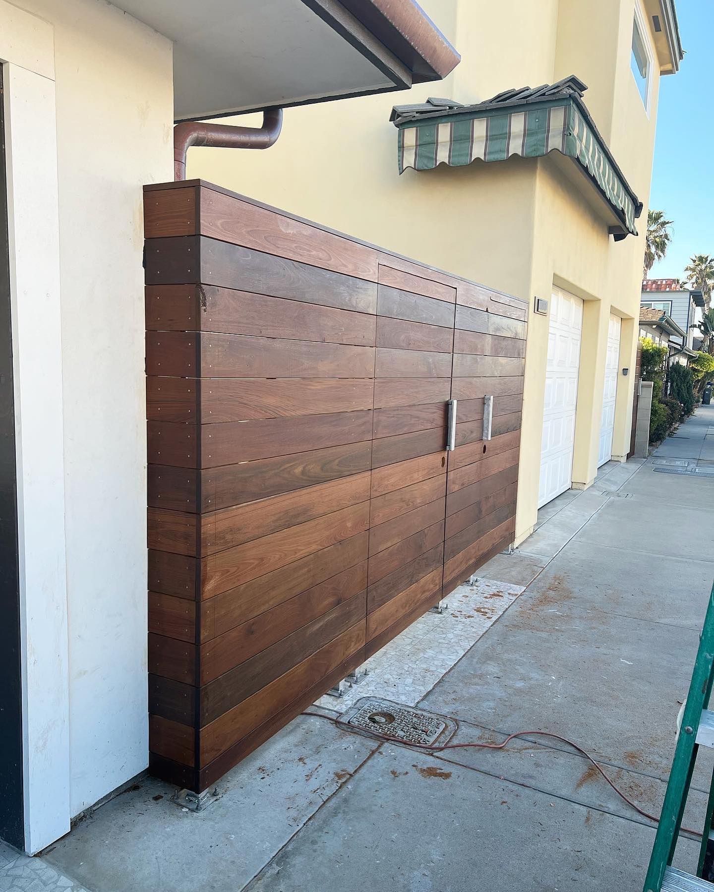 A building with a wooden fence on the side of it