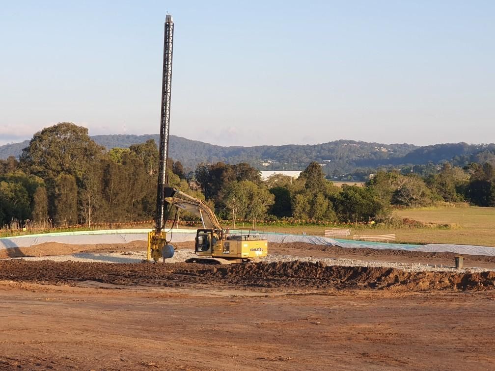 A Construction Site With a Large Yellow Drill — North Coast Drilling & Wicks in Bangalow, NSW