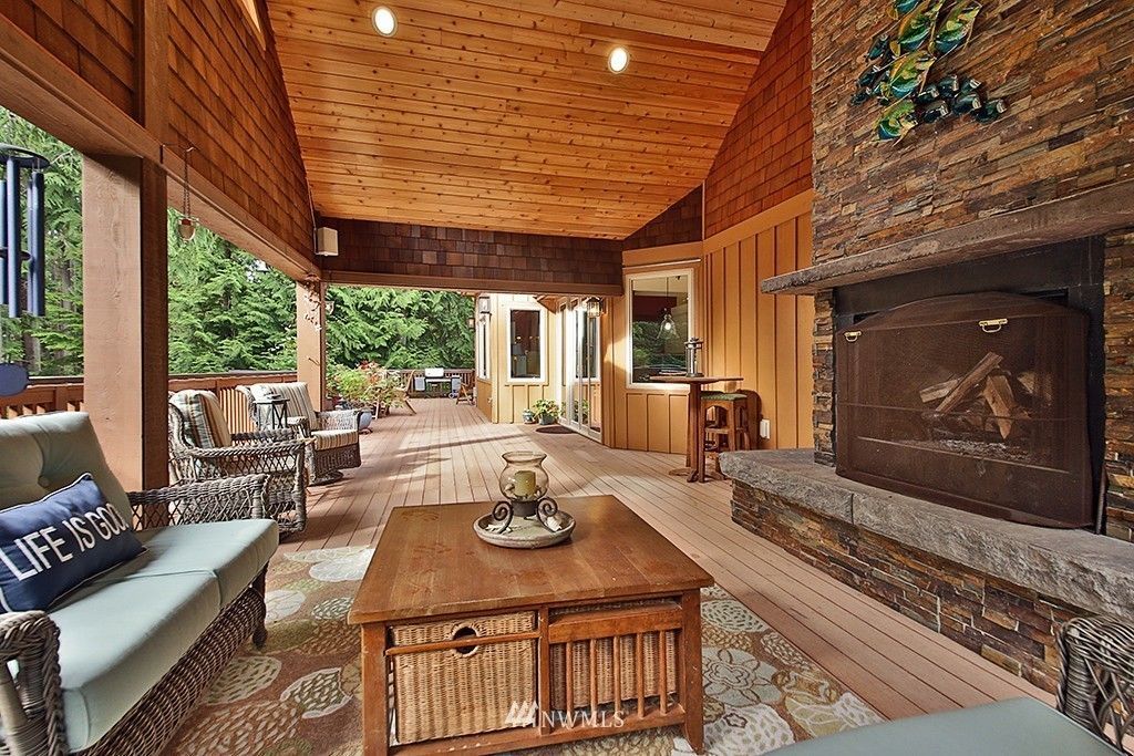 A living room with a fireplace and a coffee table