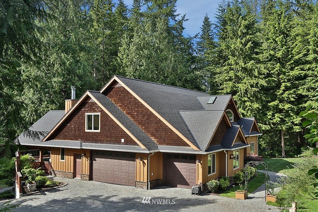 A large house with a lot of trees in the background