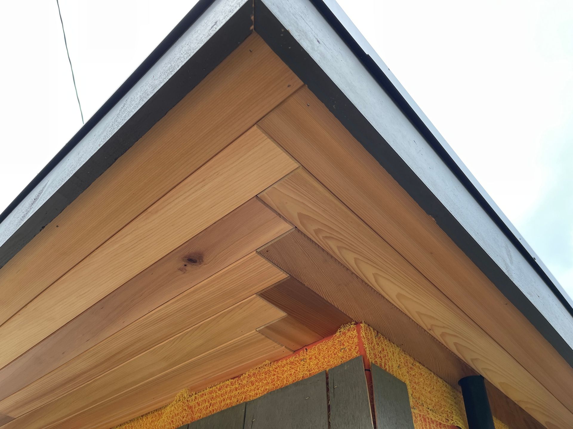 A close up of a wooden ceiling on a building