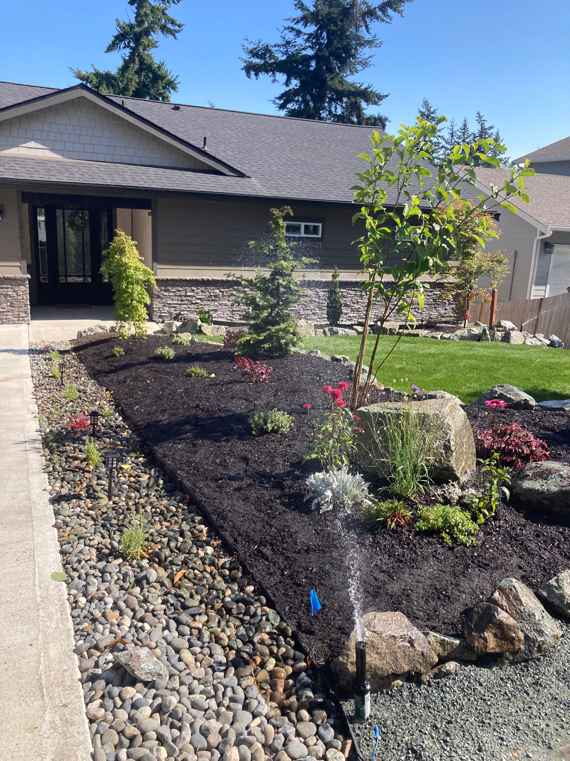 A house with a garden in front of it