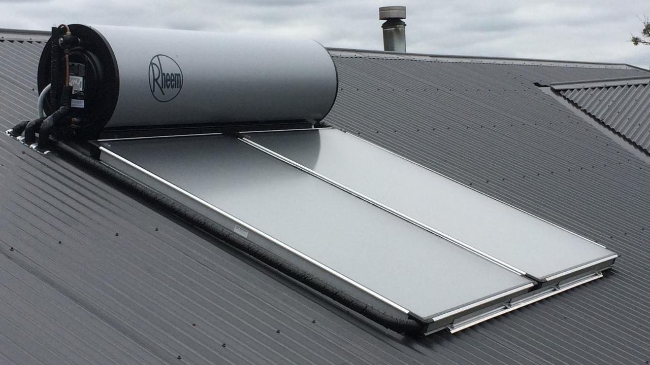 A water heater is sitting on top of a roof.