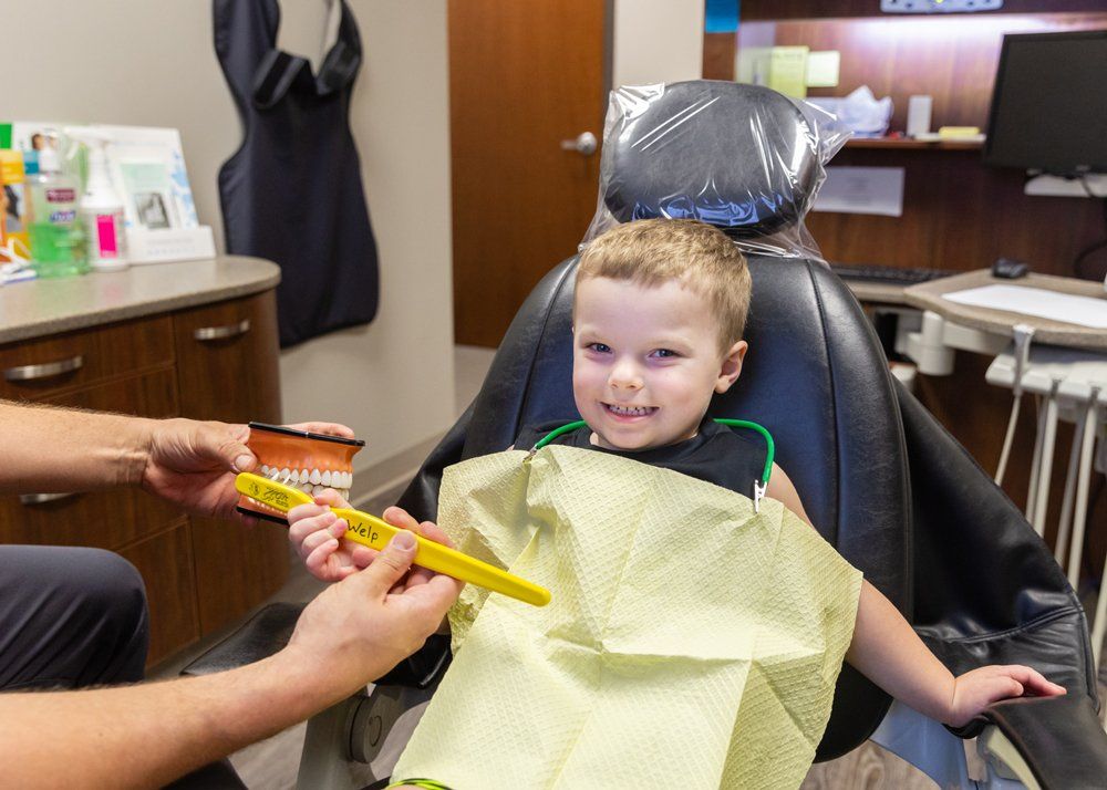 Kid Dentist — Kid in Dentist Chair in Jasper, IN