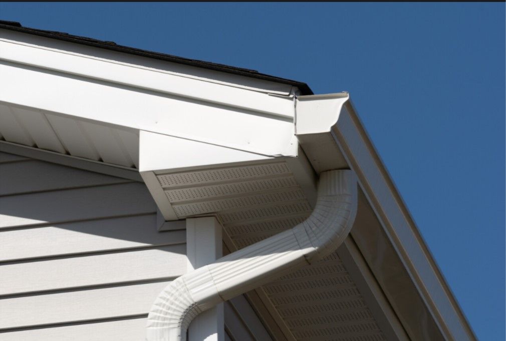 A house with a gutter on the side of it