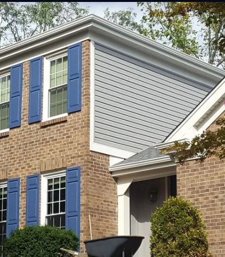 An aerial view of a house with a grey roof.
