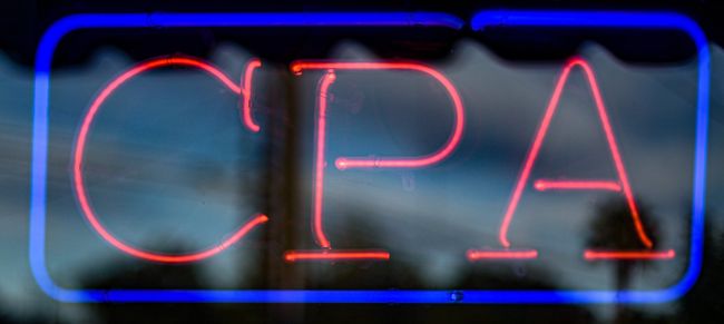 A neon sign that says cpa in red and blue