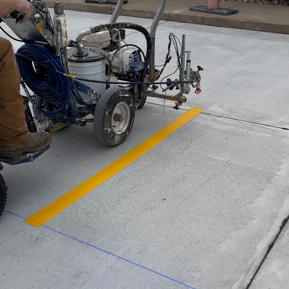 Parking Lot Striping Machine Laying down lines on concrete in St Louis, MO