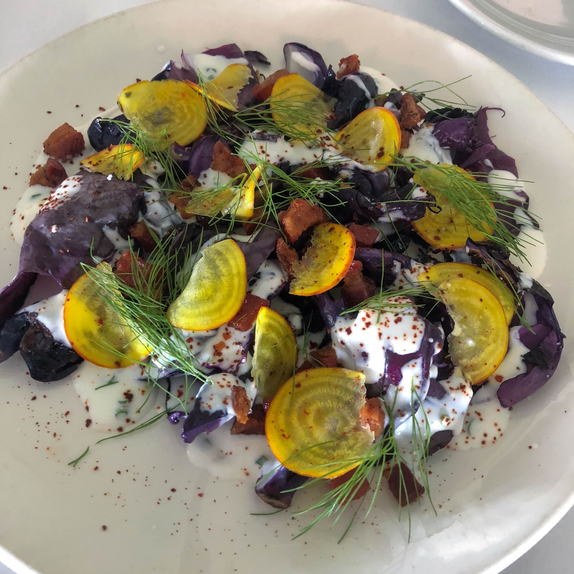 A white plate topped with a variety of vegetables