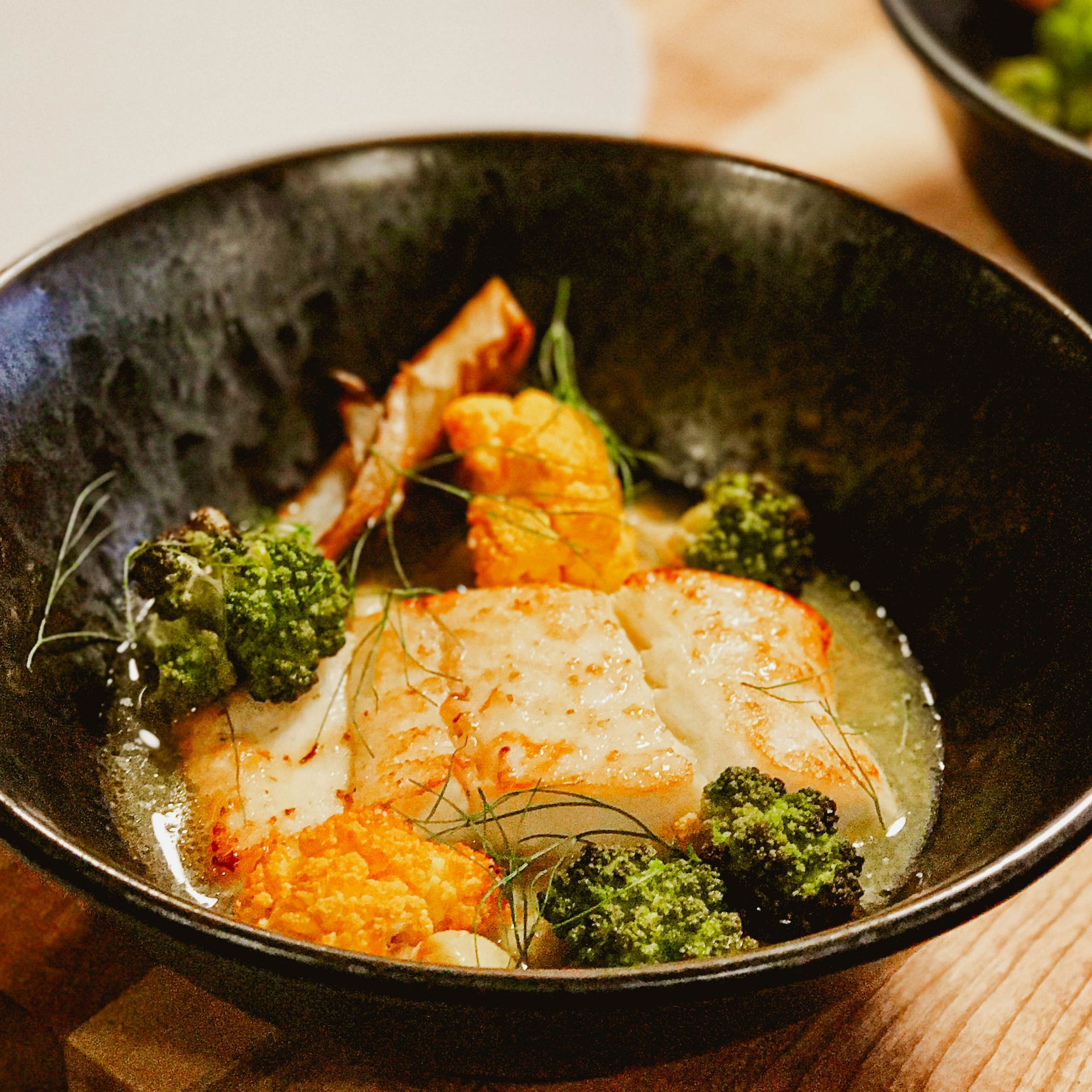 A close up of a bowl of food on a table