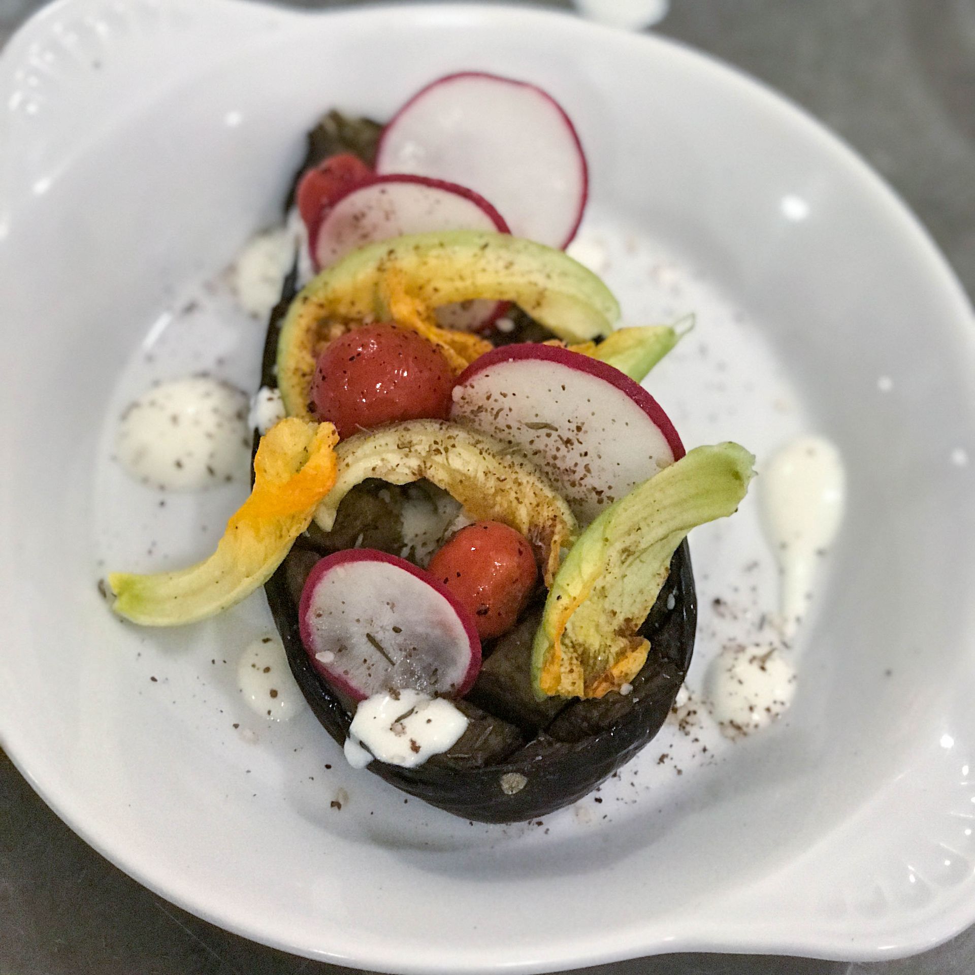 A white plate topped with a variety of fruits and vegetables