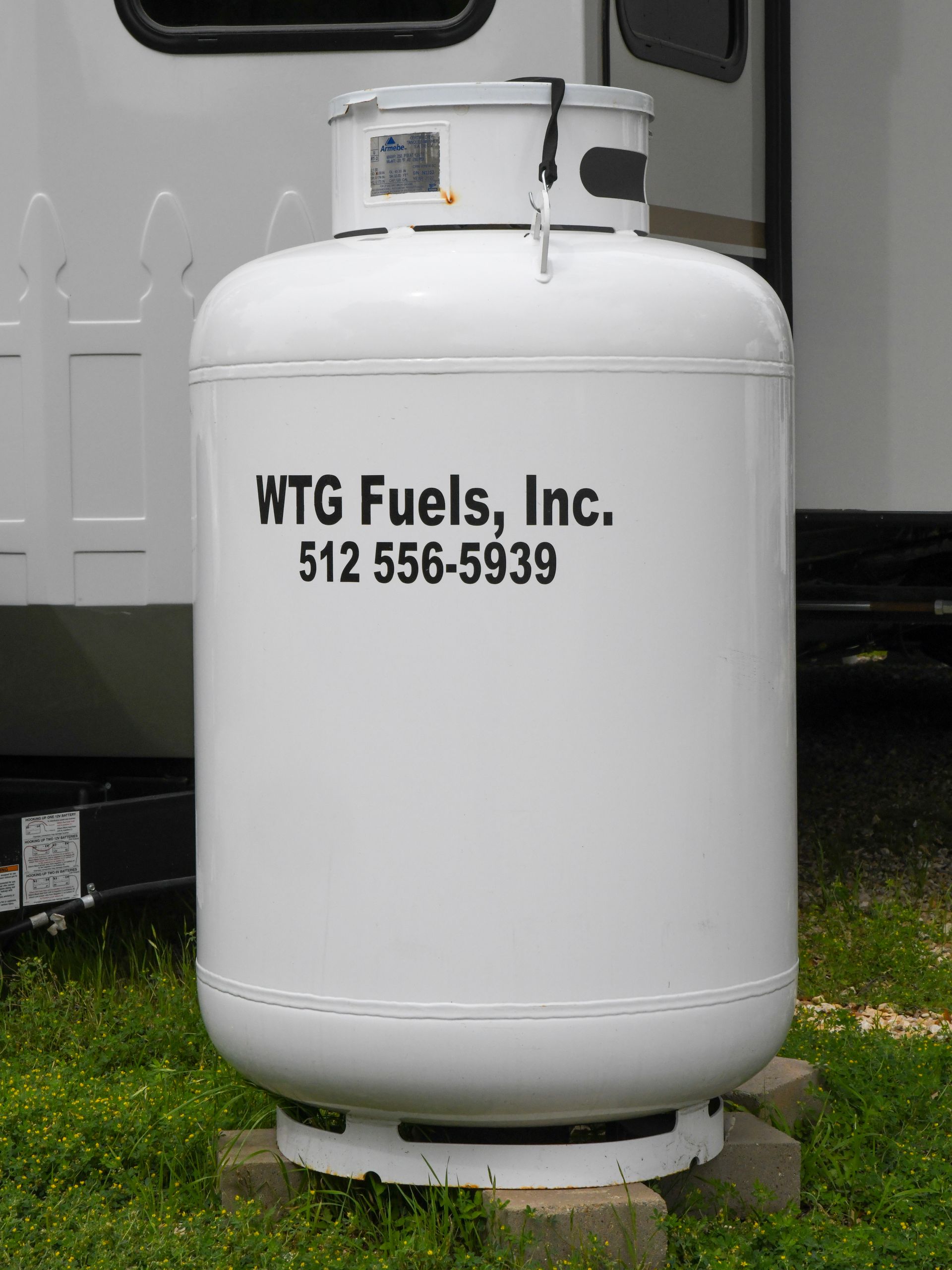 A white propane tank says wtg fuels inc. on it