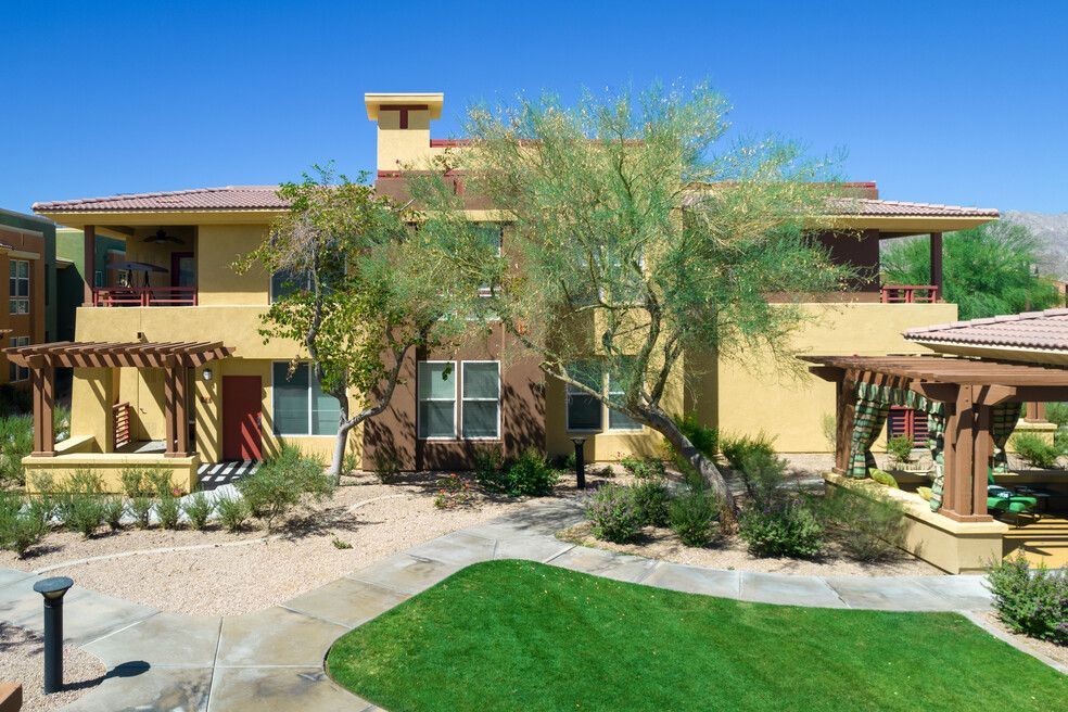 A large house with a large lawn in front of it
