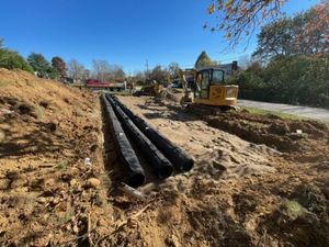 A hose is coming out of a septic tank.