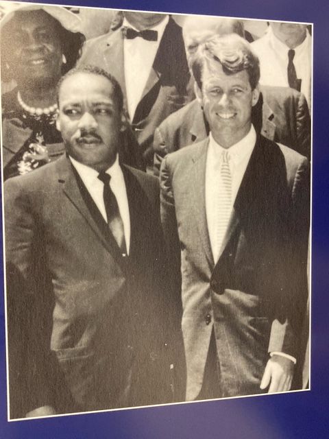 Martin Luther King Jr. and Robert F. Kennedy standing side-by-side, likely outdoors, suited.