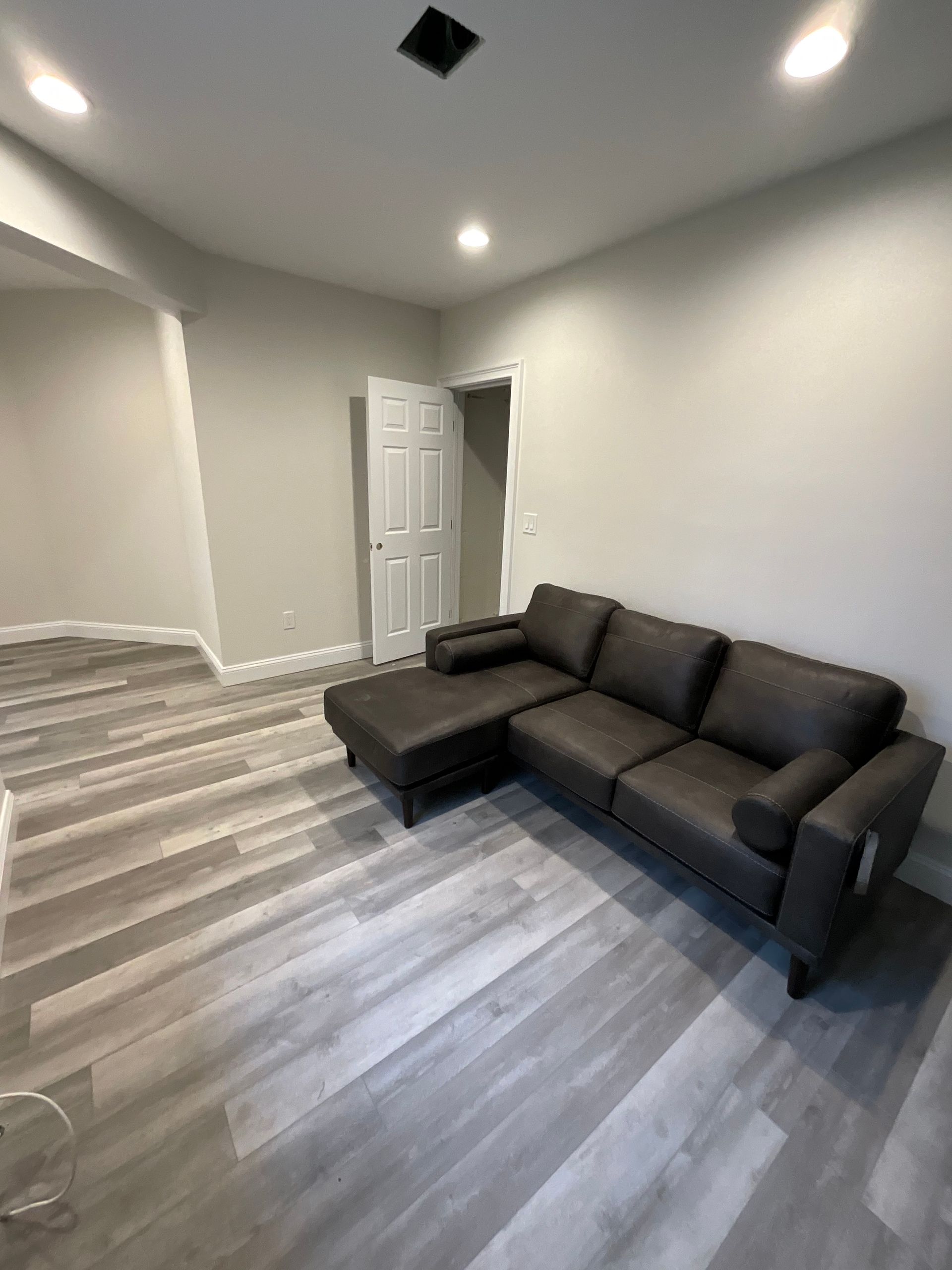 There is a couch in the middle of the room.