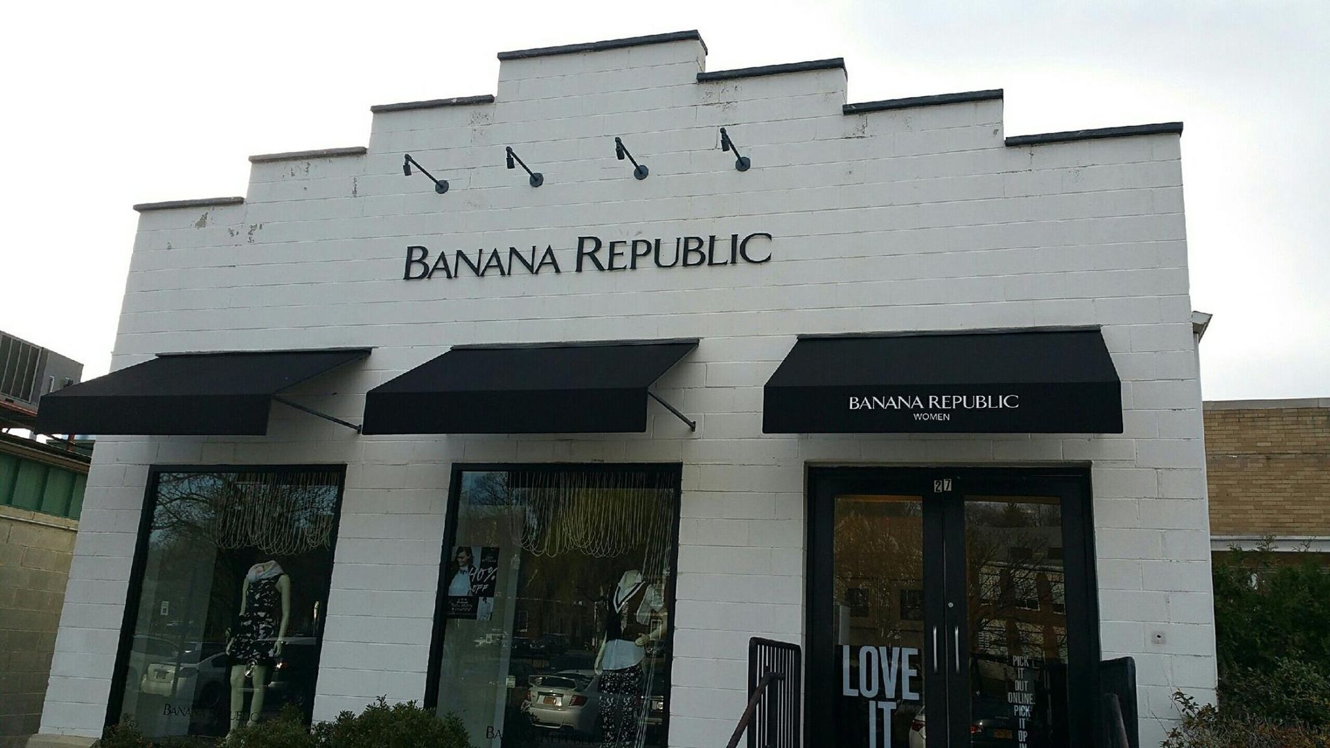 A large house with a black truck parked in front of it