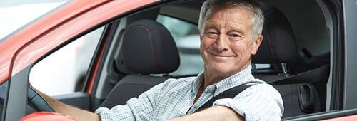 Old Man Happy in The Car - Auto Insurance in Fort Wayne, IN