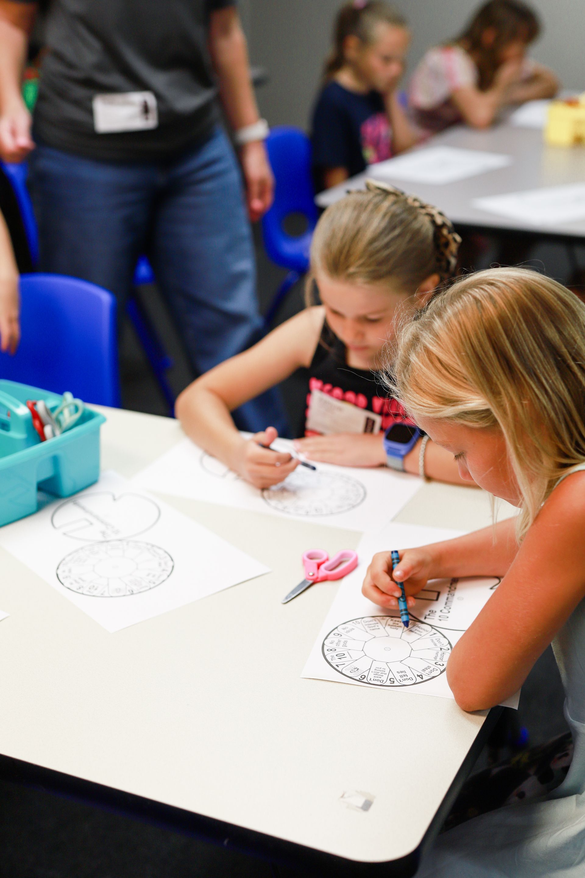 Kids standing on front of blackboard