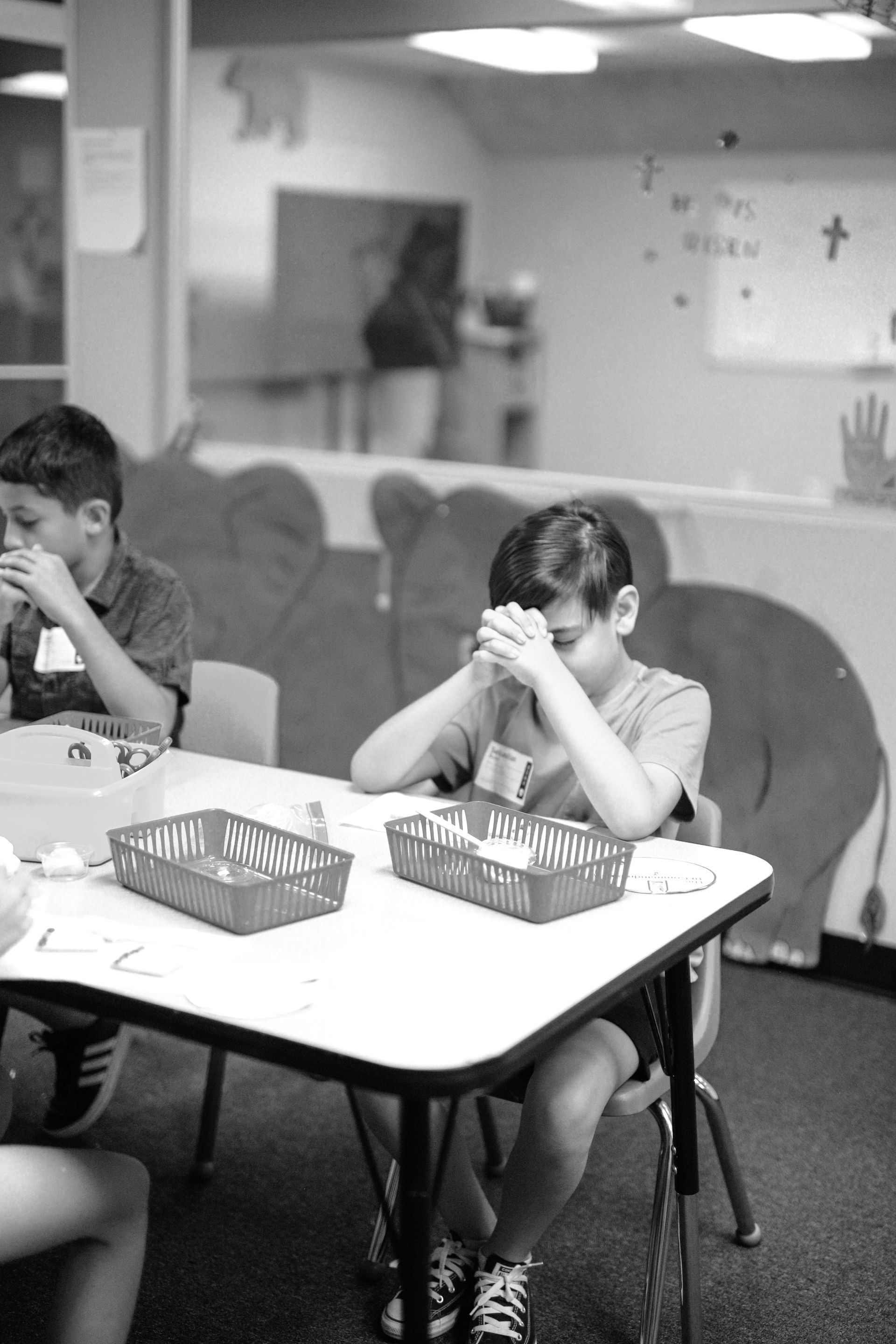 Two young boys are posing for a picture together