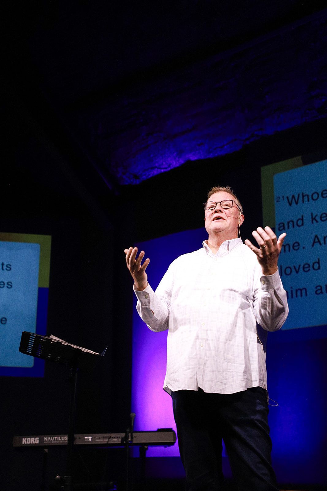 A black and white photo of a group of people sitting in a living room