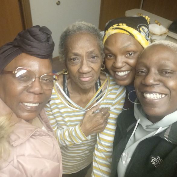 A group of women are posing for a picture together