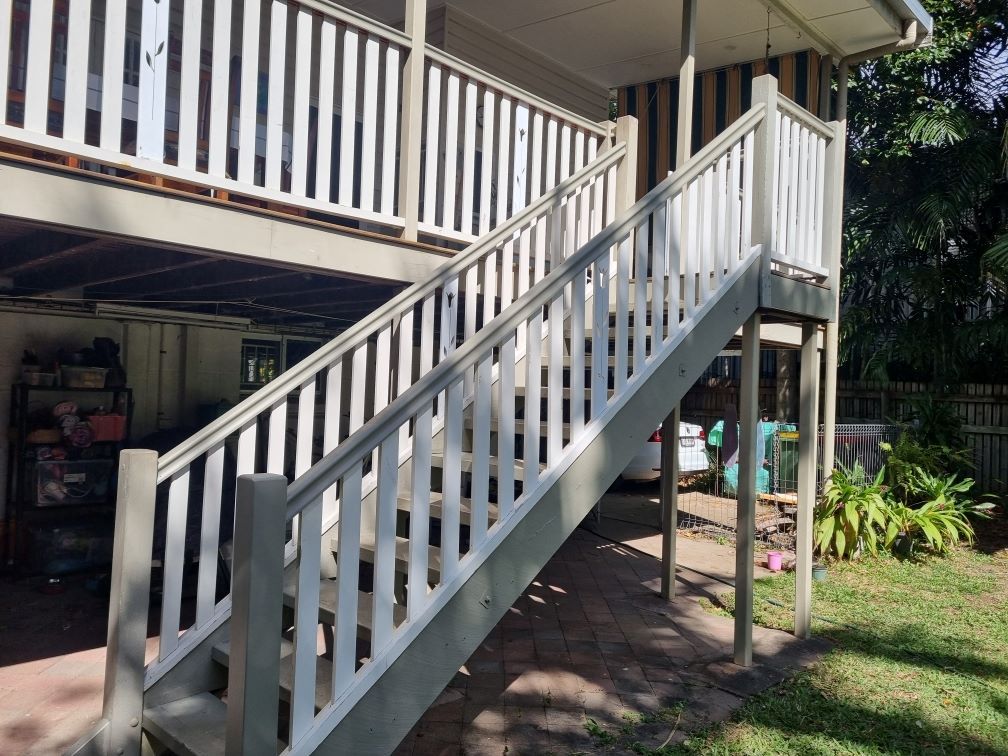 A White Staircase Leading Up To The Second Floor Of A House — FNQ Maintenance Services In Parramatta Park, QLD