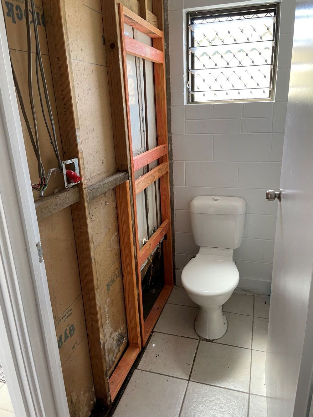 A Bathroom Under Construction With A Toilet And A Window — FNQ Maintenance Services In Parramatta Park, QLD