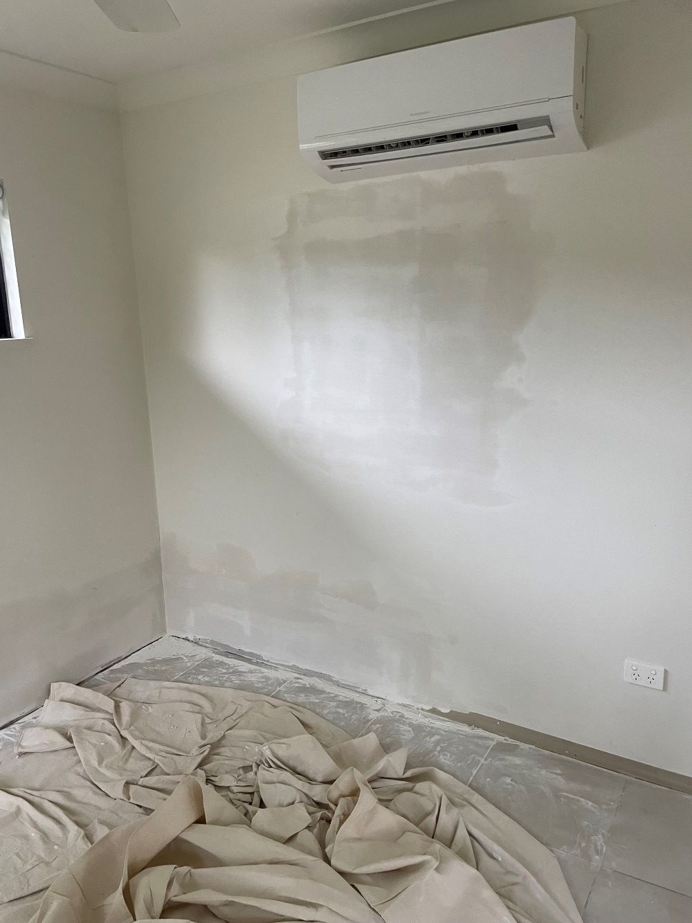 A Room With A Bed And A Wall Under Renovation — FNQ Maintenance Services In Parramatta Park, QLD