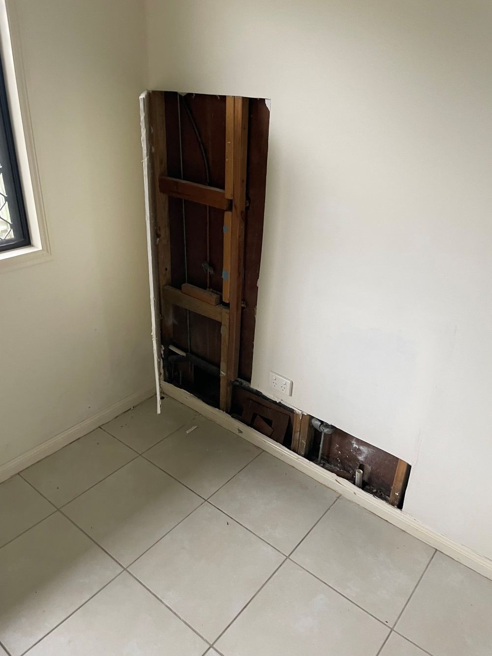 A Room With A Hole In The Wall And A Window — FNQ Maintenance Services In Parramatta Park, QLD