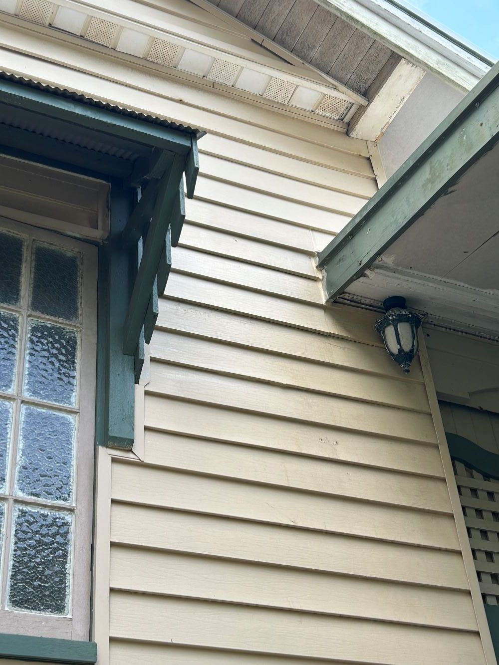 A House Restoration With A Window And A Lamp On The Side — FNQ Maintenance Services In Parramatta Park, QLD