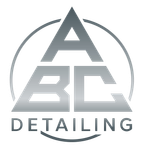 Gray “ABC Detailing” logo with stylized letters inside a circle on a white background