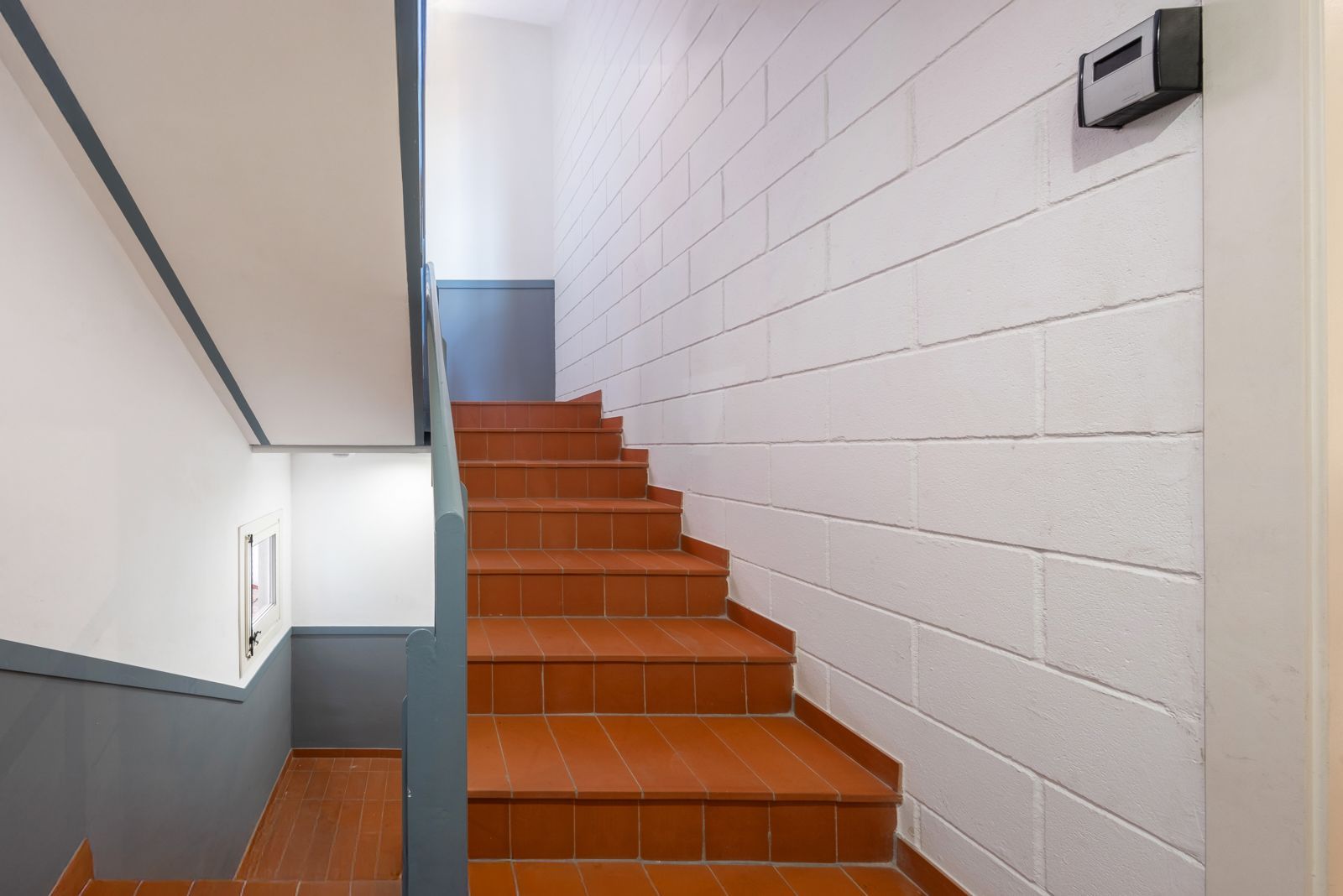 A set of stairs leading up to the second floor of a building.