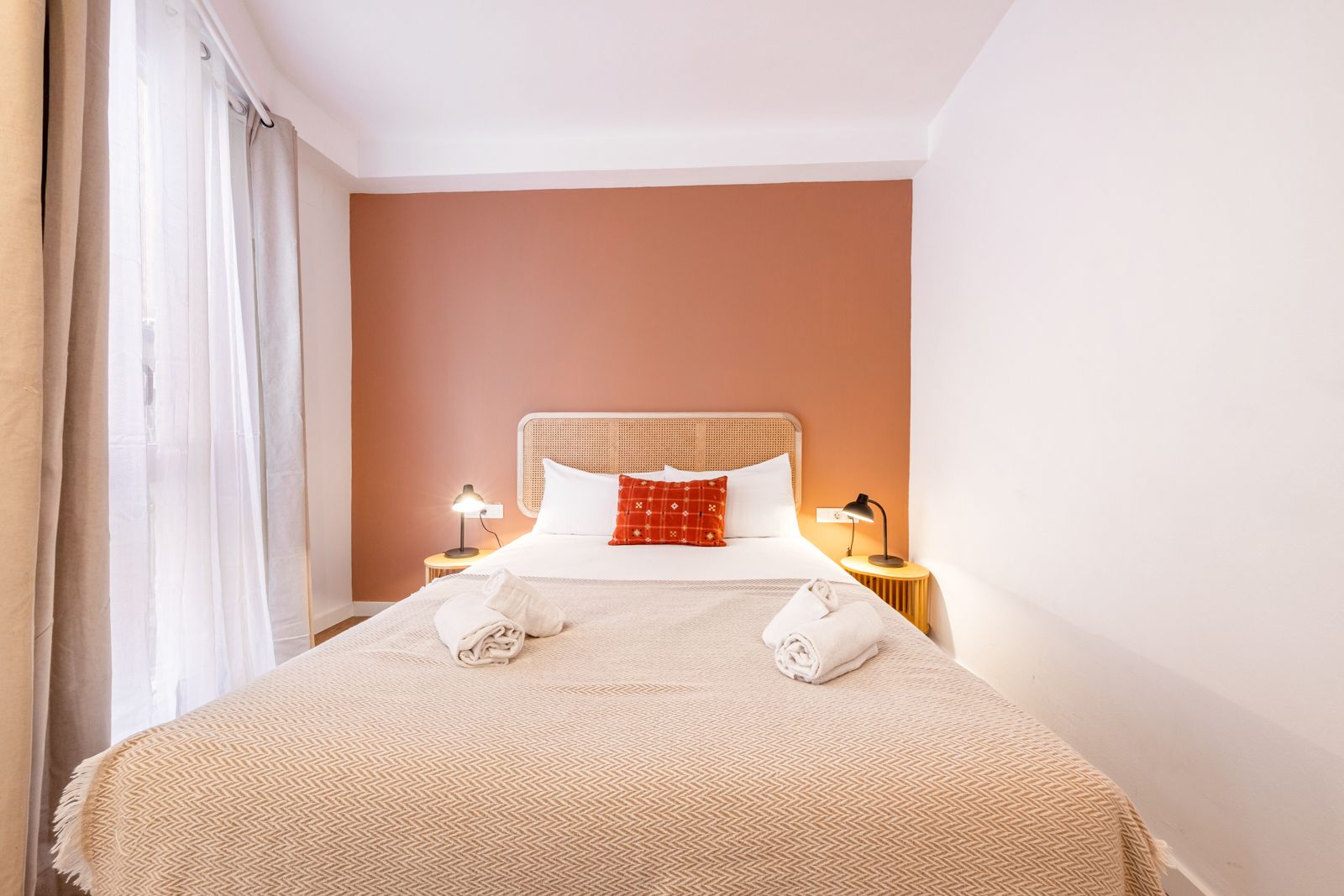 There is a bed in the middle of the room.