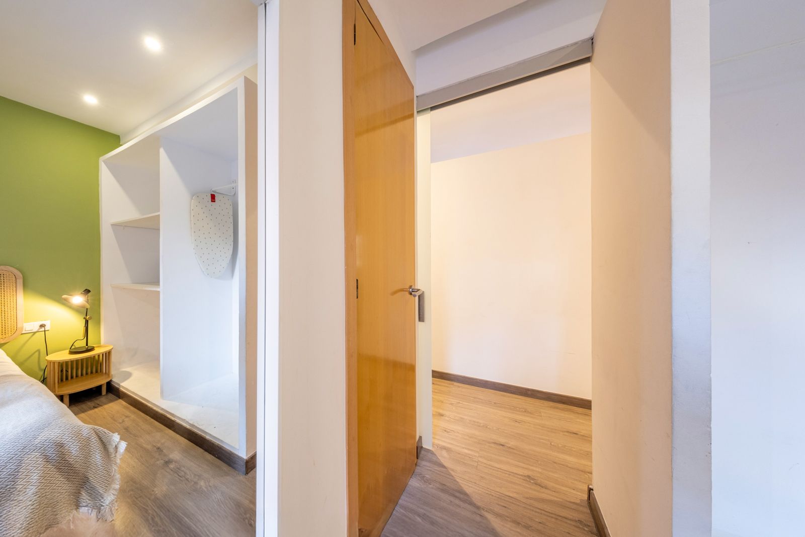 A bedroom with a closet and a door leading to a walk in closet.
