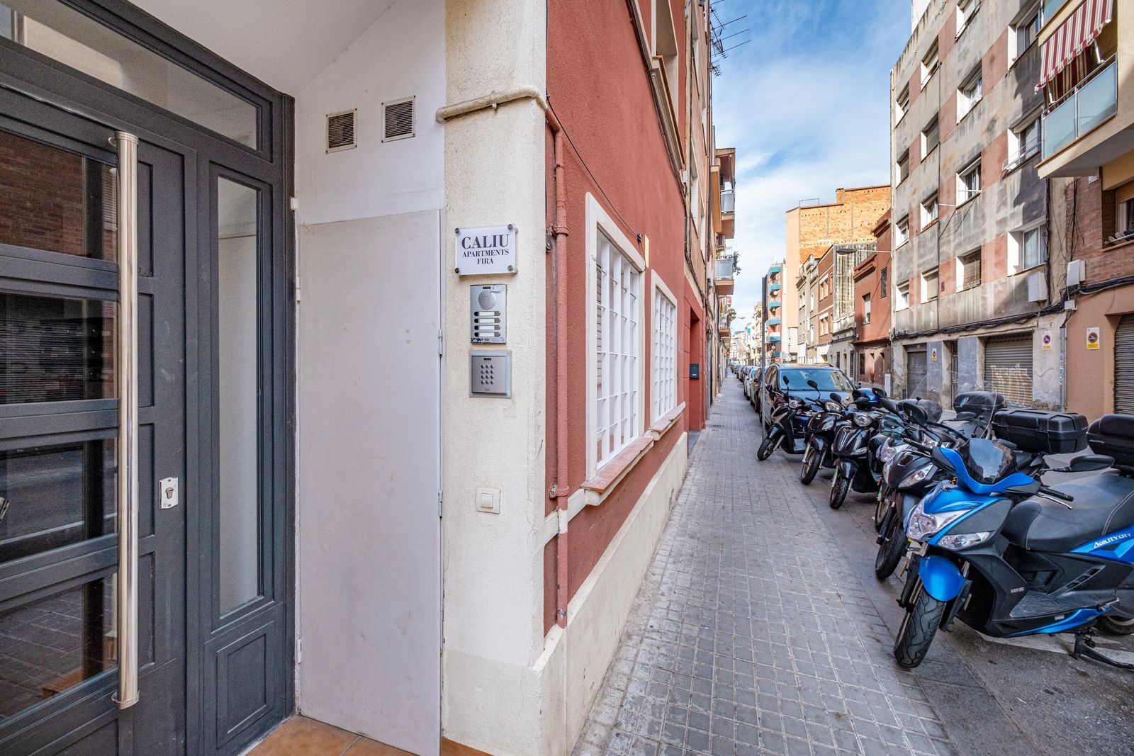 A building with a lot of motorcycles parked in front of it.