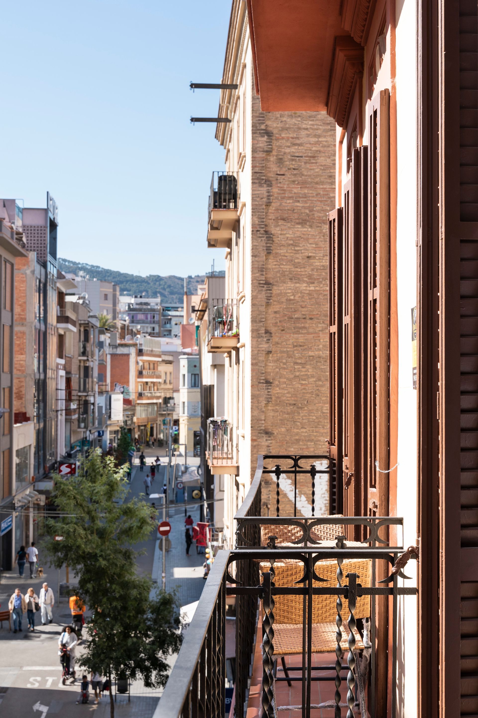 A balcony with a view of a city street